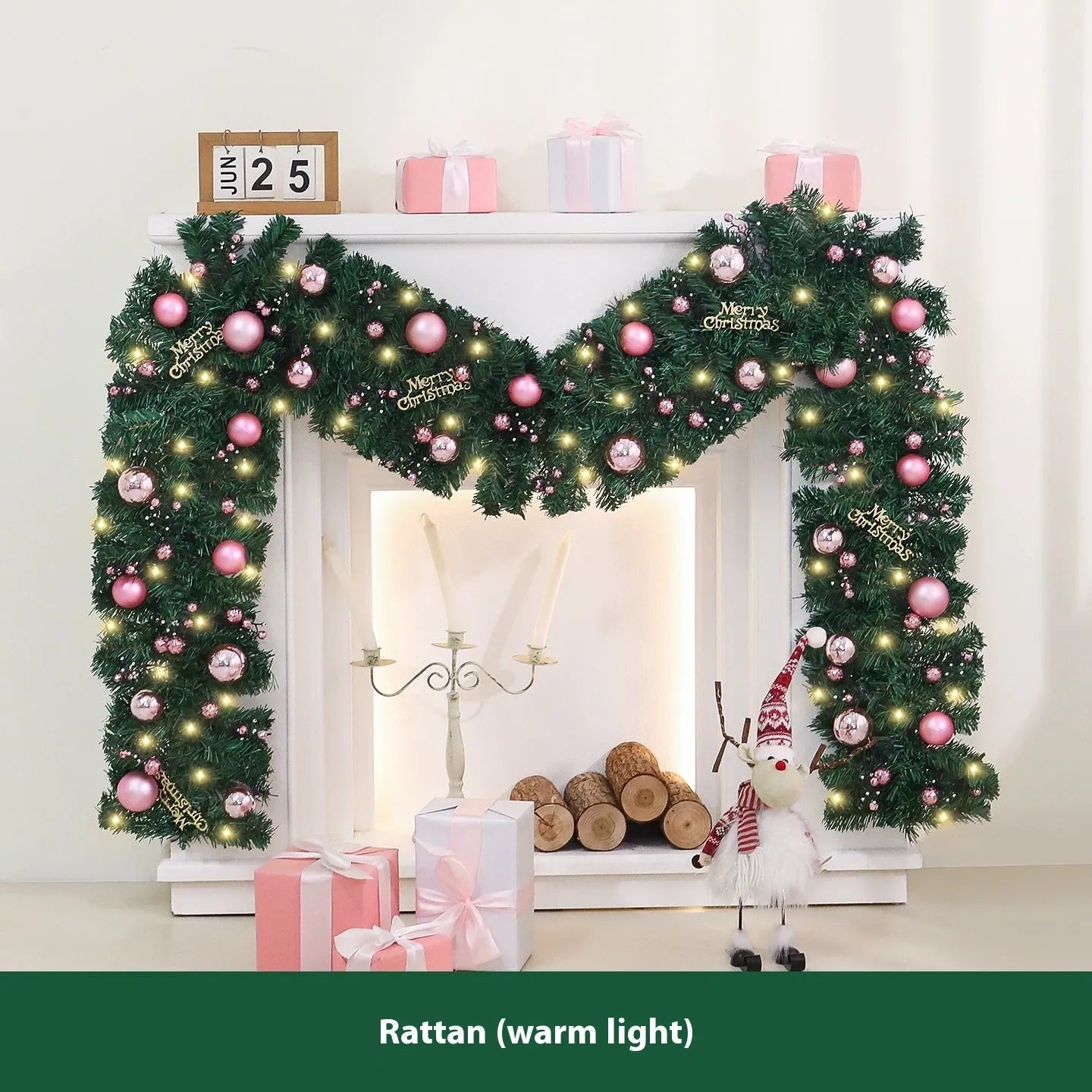 2.7 metre long pink artificial Christmas rattan vine decoration with small berries and leaves against a wall.
