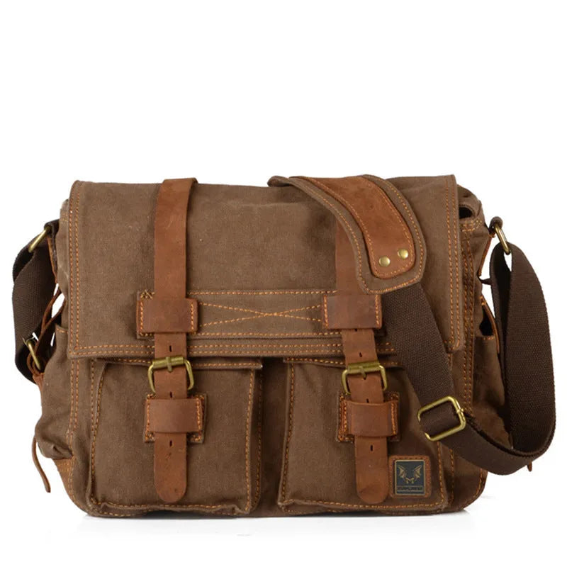 Men's brown canvas crossbody shoulder bag with leather trim shown open, revealing internal organiser pockets.