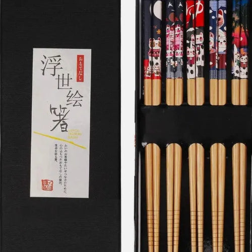 Set of five pairs of bamboo chopsticks with Japanese cartoon patterns in a gift box.