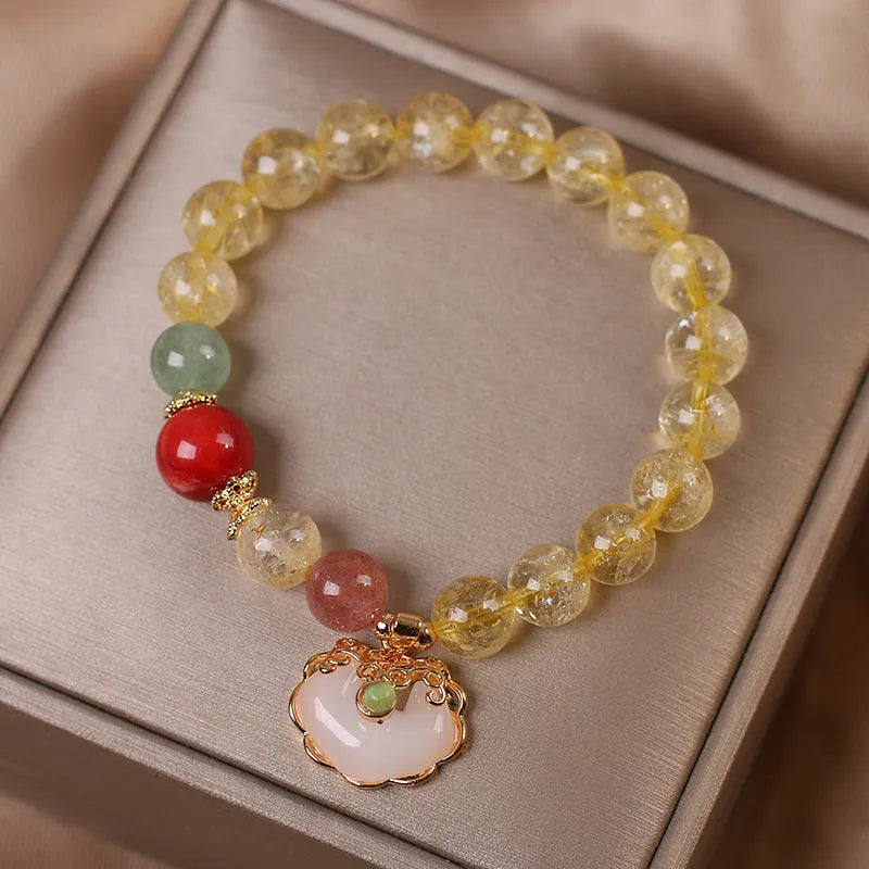 Women's alloy bracelet with a yellow citrine jade ruyi pendant charm.