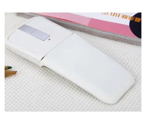 Folding wireless Bluetooth mouse showing compact design with touch surface and portable folded position