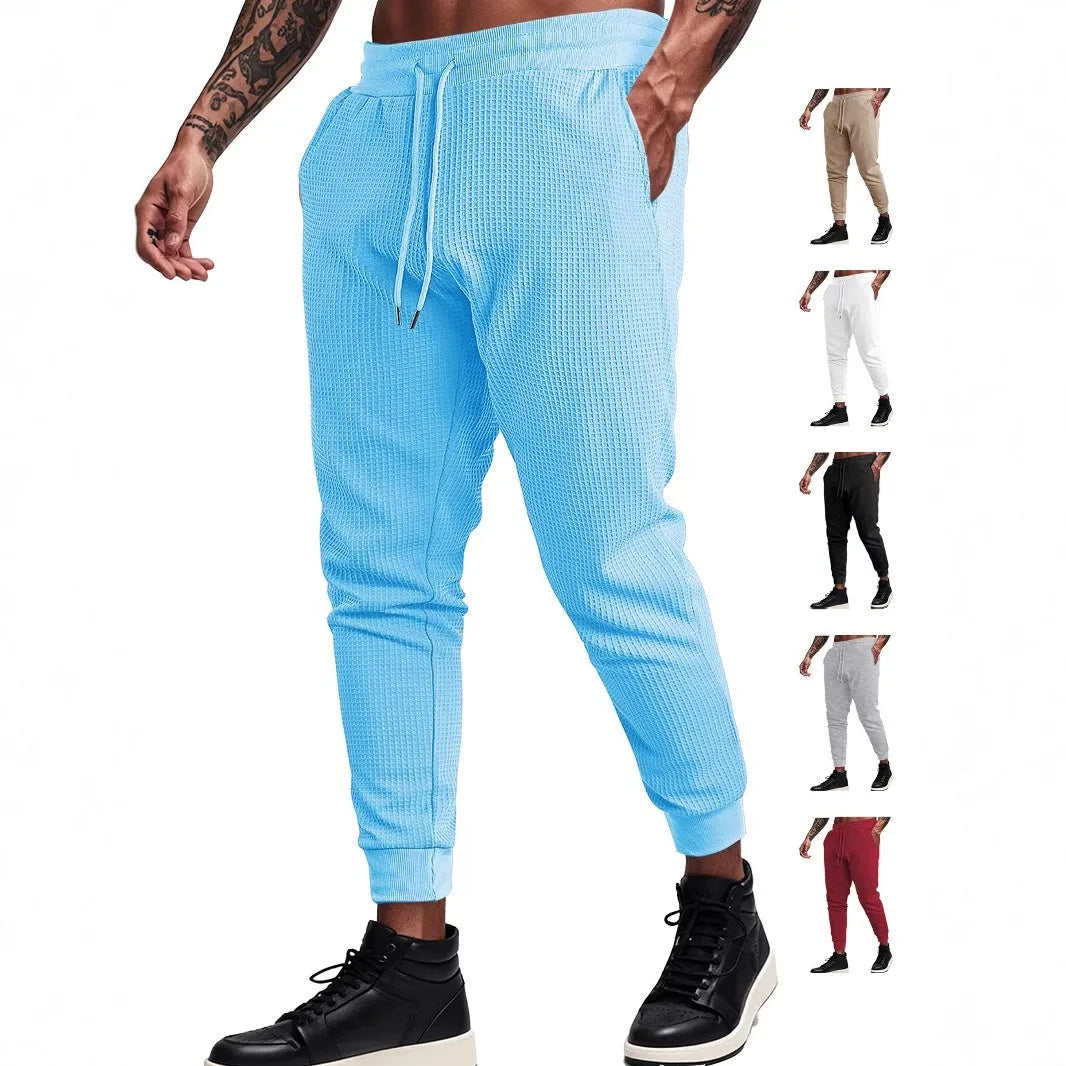 Men's casual loose solid colour drawstring pants in waffle knit polyester, front view