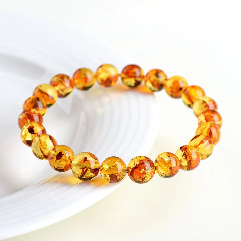 Natural yellow piebald amber bracelet with polished geometry beads for water purification