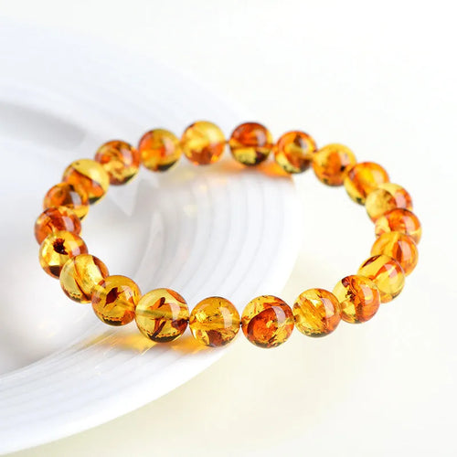 Natural yellow piebald amber bracelet with polished geometry beads for water purification