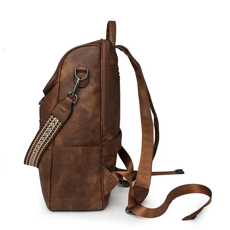 Retro college student backpack in black with curved shoulder straps and stitching detail