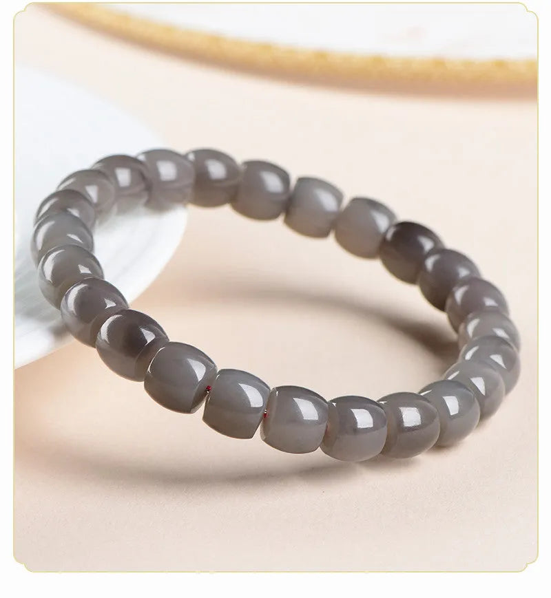 Straight cut Hetian jade bracelet with smokey violet beads measuring 8x9mm