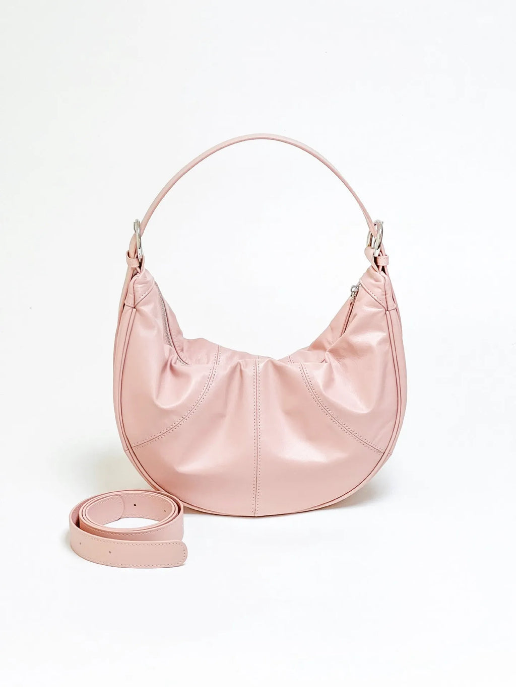 Women's soft cowhide leather shoulder bag with dumpling shape showing sandwich pocket and double joint straps