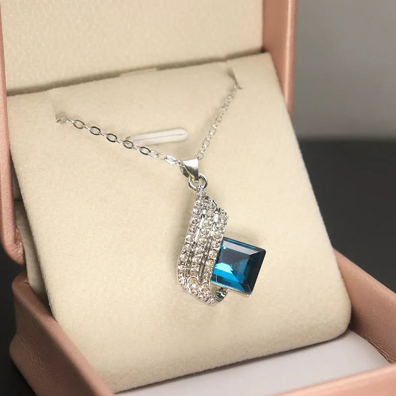 Women's necklace and ear stud set with cross chain design and glass pendant jewellery