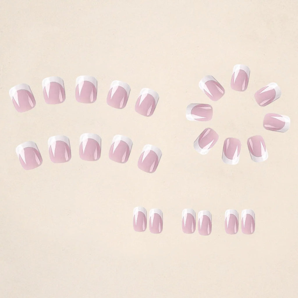 24 white fake nails with plaid patterns arranged as nail tips