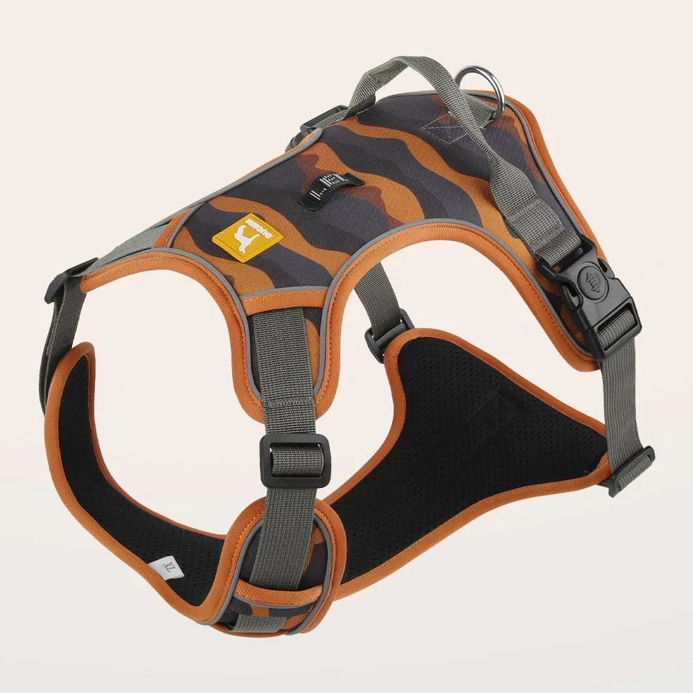 Orange reflective dog chest and back harness with hand-holding rope on a neutral background.