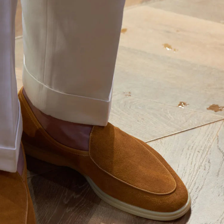 British handmade brown leather loafers for men on a white background