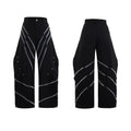 Men's black trousers with metal rivet pleats and a tapered leg, showing three-dimensional cutting.