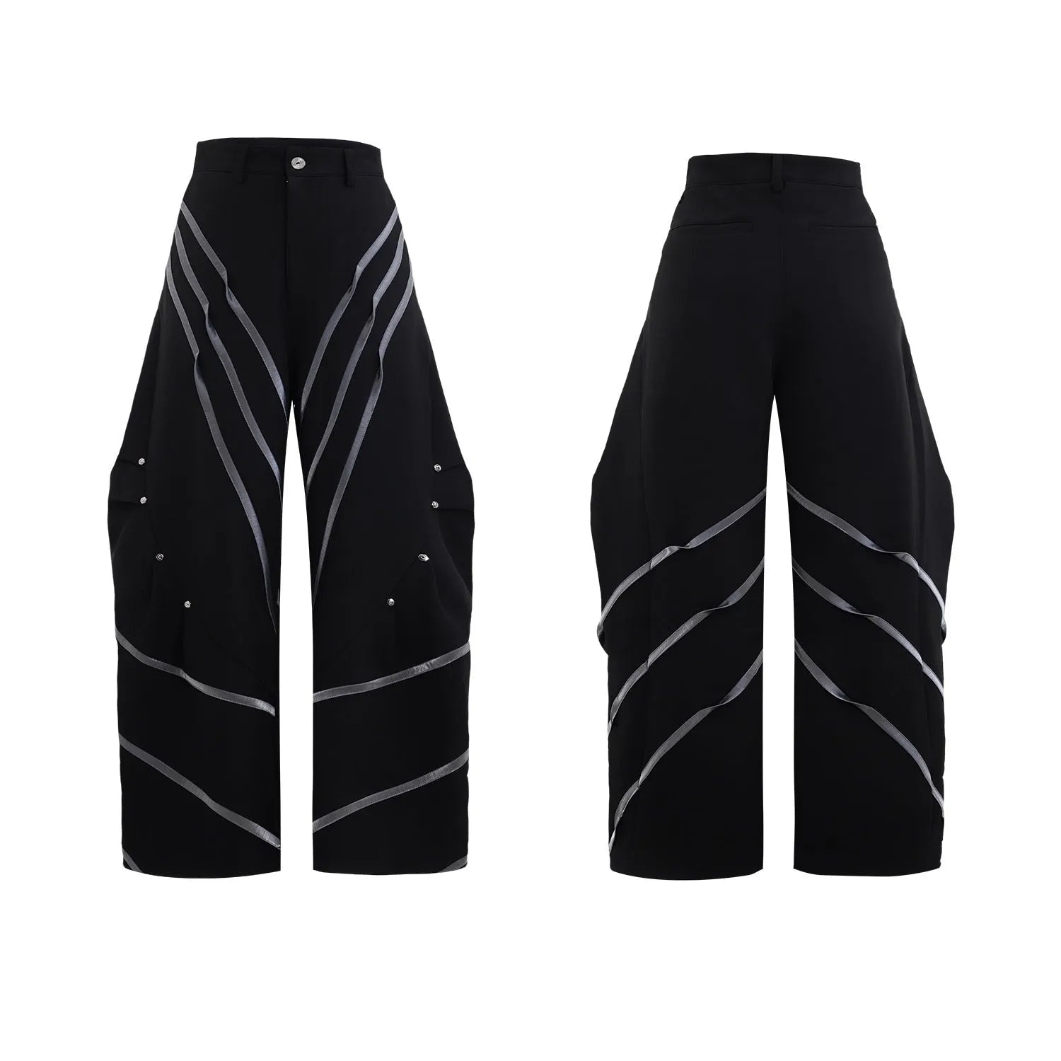 Men's black trousers with metal rivet pleats and a tapered leg, showing three-dimensional cutting.