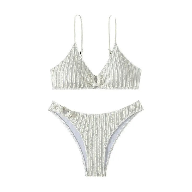 White women's V-neck beach swimsuit with split style and sleeveless design.