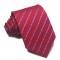 Close-up of a man's striped jacquard woven tie in a classic arrow shape, showing textured fabric detail.