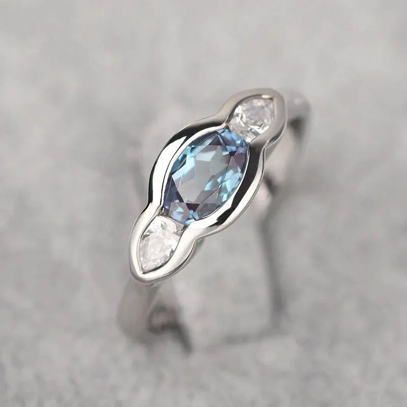 Geometric ellipse women's ring with inlaid zircon stone in white gold plating