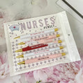Set of five plastic retractable ballpoint pens with nurse-themed text and slogans.