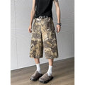 Yellow snake pattern camouflage cropped jeans with cotton denim construction showing tooling detailing