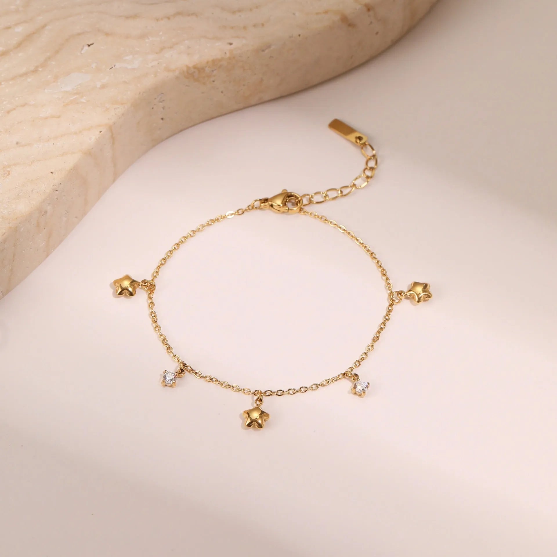 Titanium steel women's bracelet with 18K gold plating and hexagonal star zircon pendant