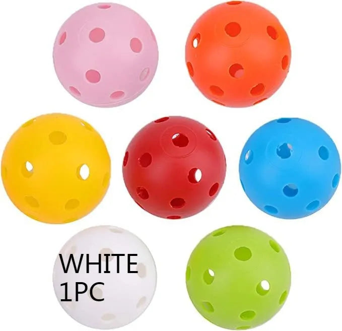Multi-colour golf practice balls in net bag with 26-hole putting layout for skill development