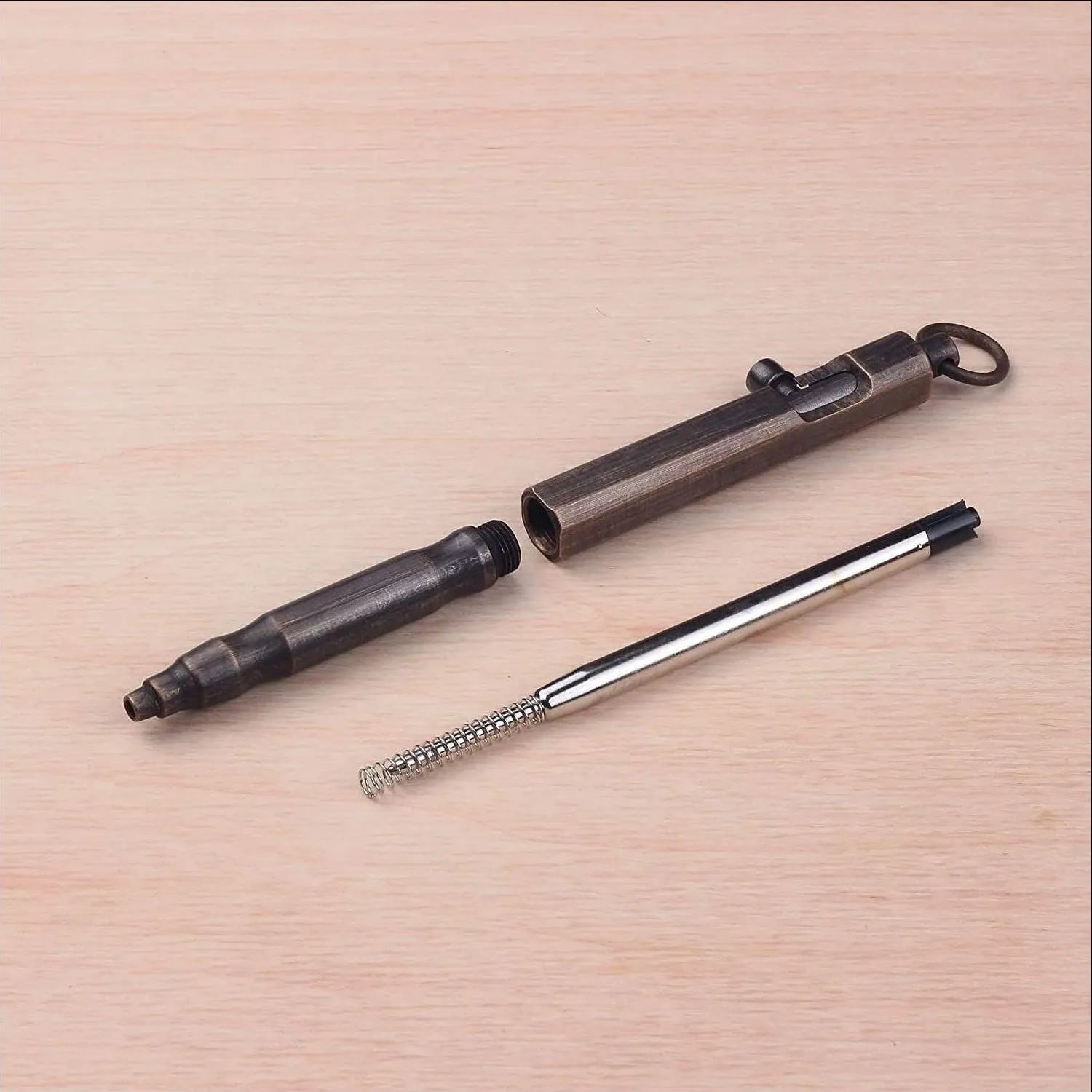 Brass tactical pen with hexagonal bolt design in natural brass colour or retro black finish