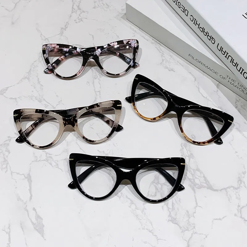 Women's cat eye shaped presbyopic reading glasses with dragon and phoenix decorations on the frame.