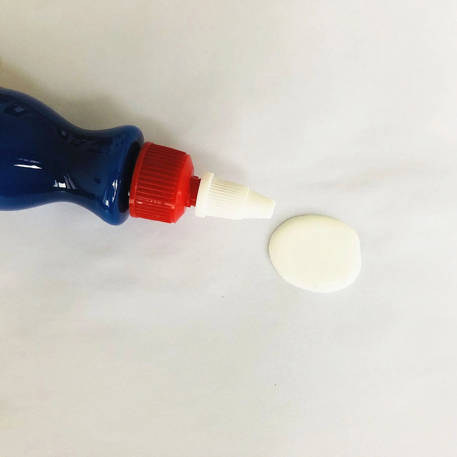 Small blue 10ml automotive scratch repair bottle with integrated applicator brush