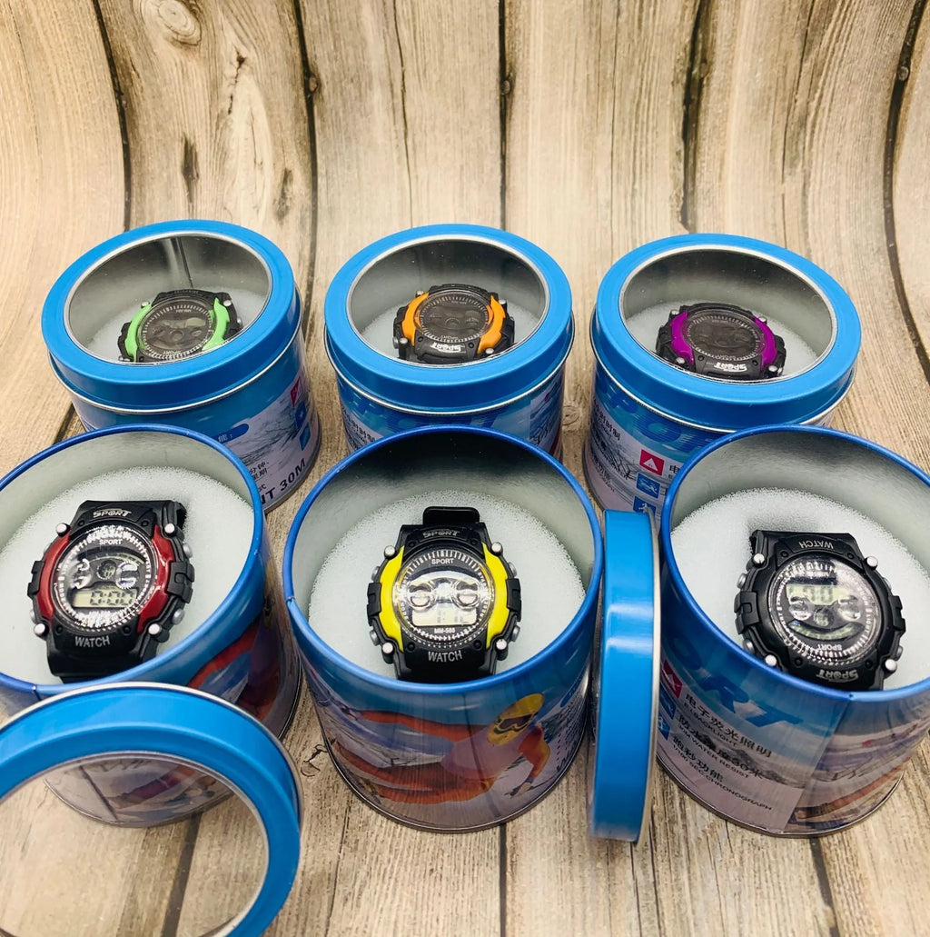 Children's digital sports watch with silicone strap and plastic case showing display with time, alarm, and calendar icons.