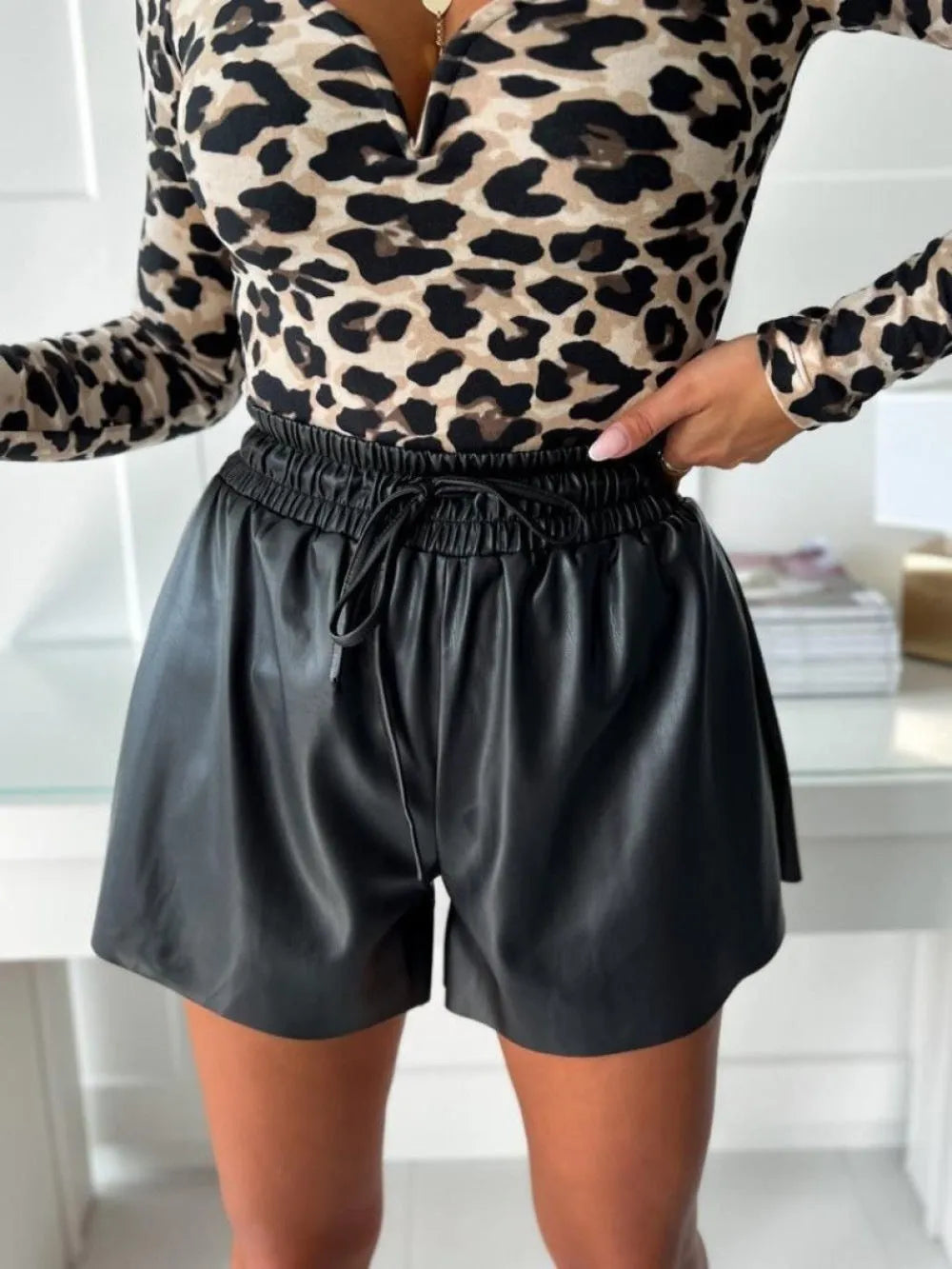 Women's black PU leather wide-leg shorts with lace-up drawstring waist detail