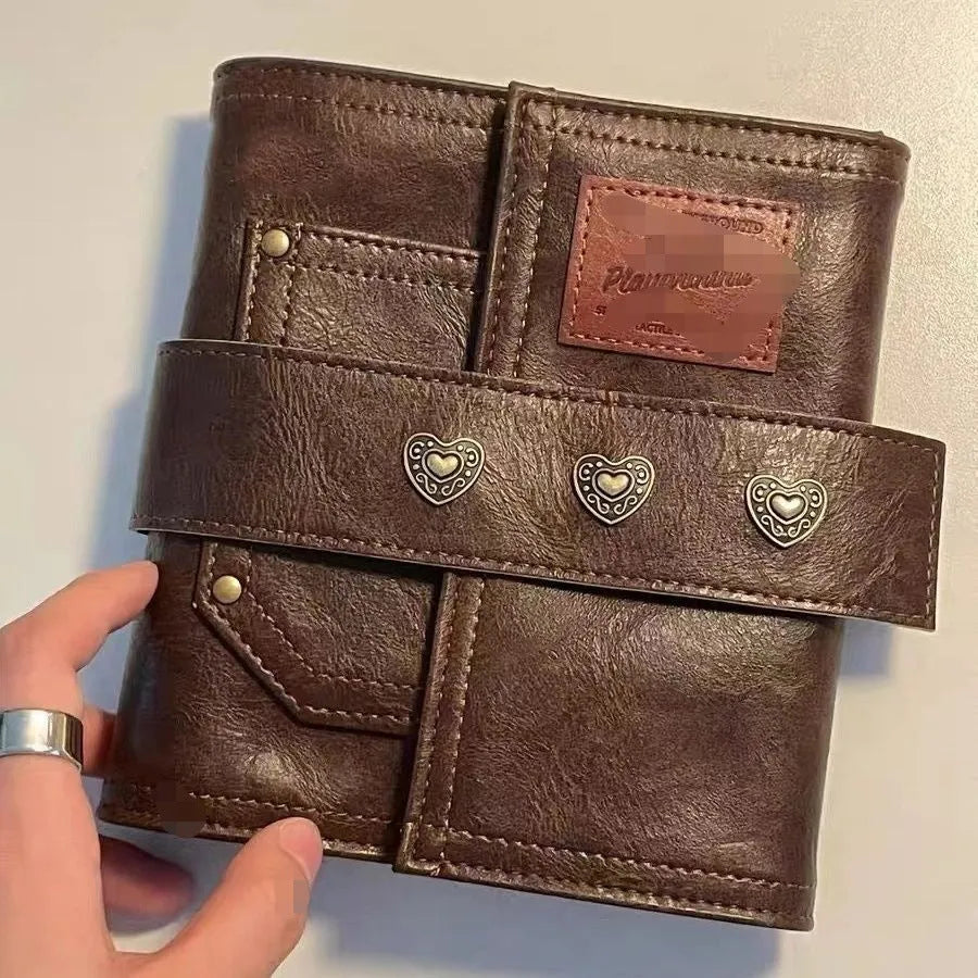 Brown retro leather-style A7 notebook with buckle closure and loose-leaf binding