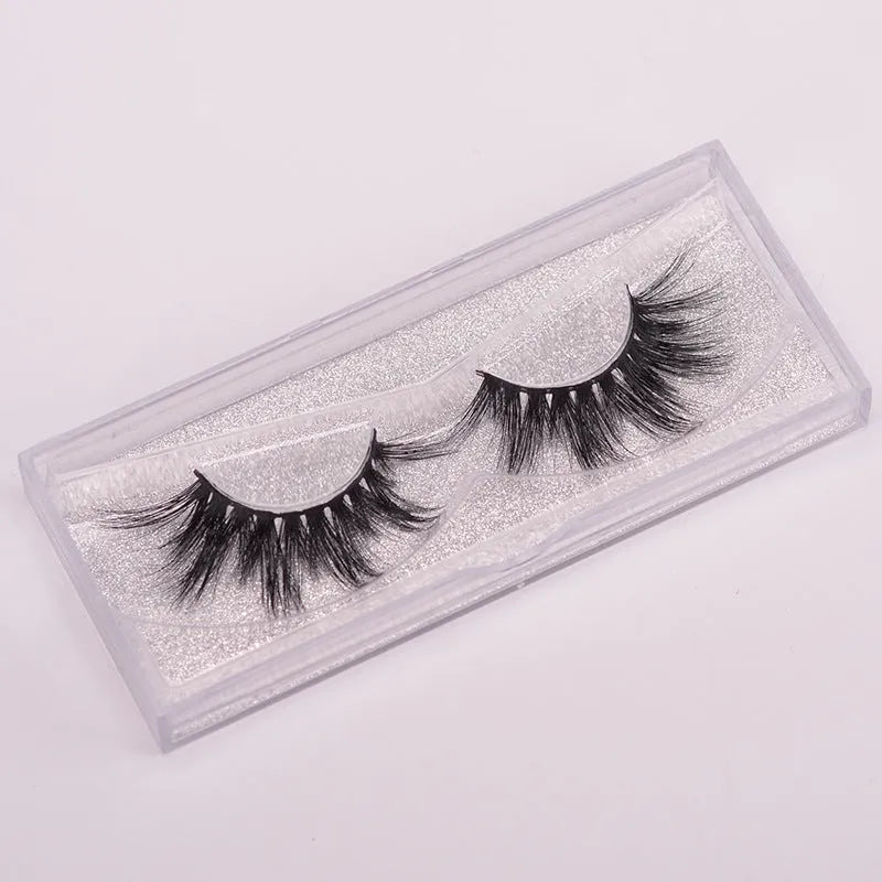 5D mink false eyelashes set with brush and hair cap on black background
