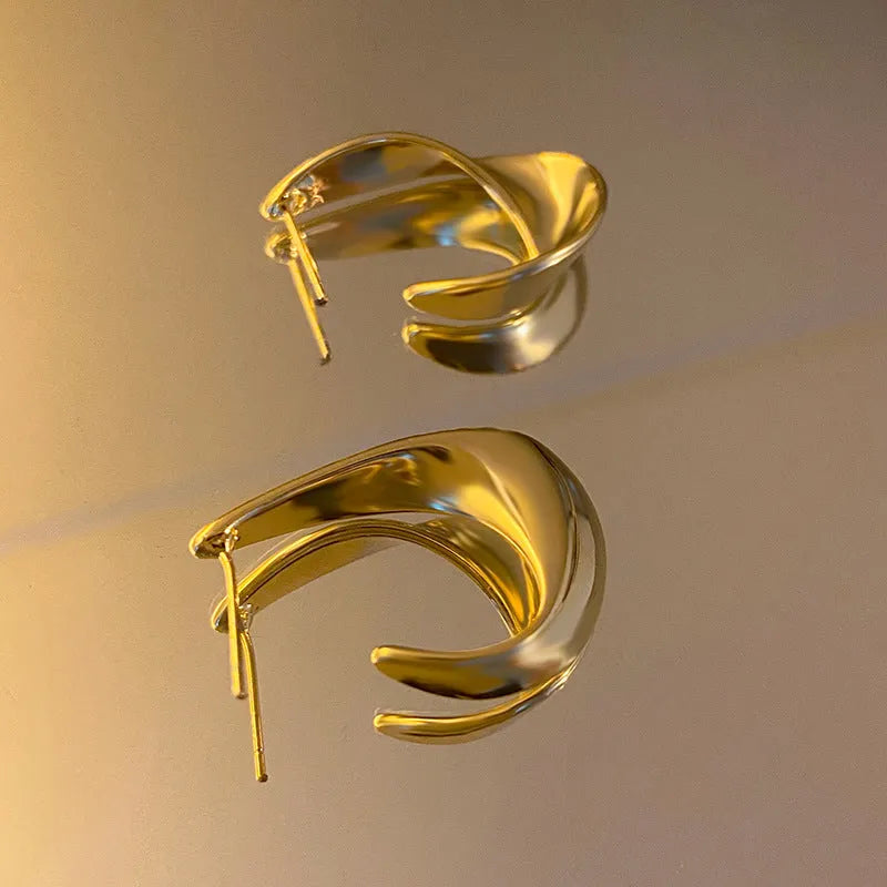 Metal geometric earrings with twisted design in gold or silver electroplated finish