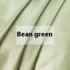 Double-sided silk duvet cover in a solid colour, shown in bright brown on a bed.
