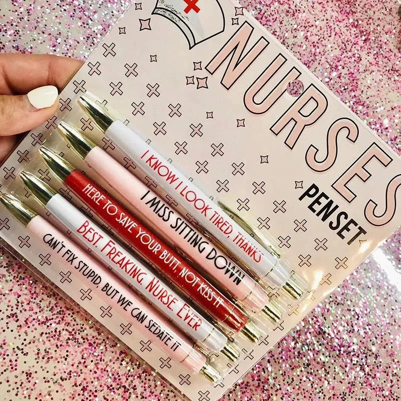 Set of five plastic retractable ballpoint pens with nurse-themed text and slogans.