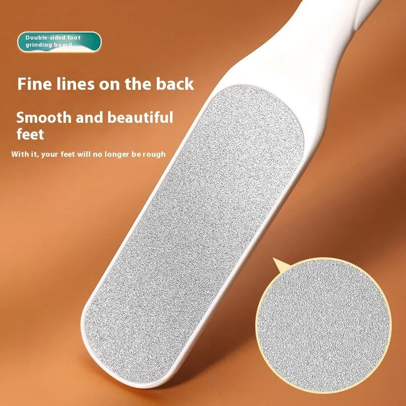 Double-sided stainless steel foot grinder with black and white grit attachments for callus removal