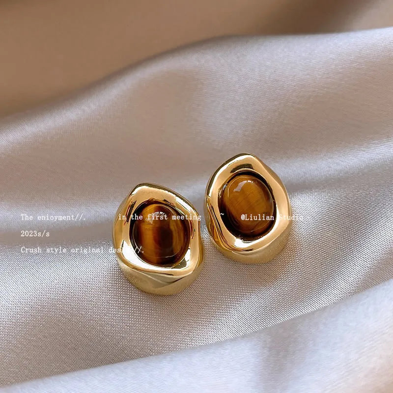 Handmade alloy earrings set showing three geometric designs: irregular amber, wafer disc and water drop tigereye styles