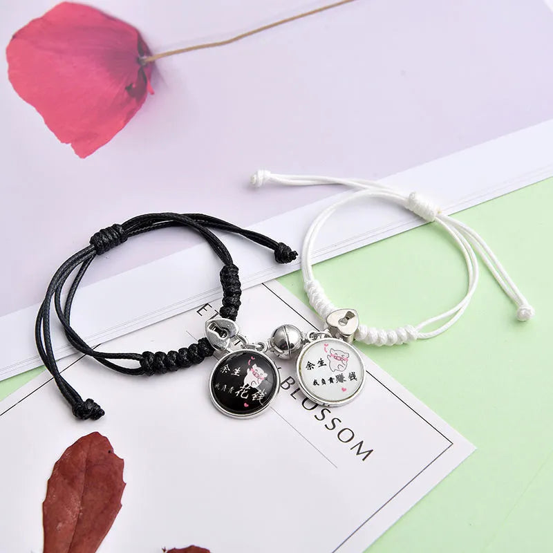 Magnetic couple suction bracelets pair with alloy electroplated finish showing various symbolic designs