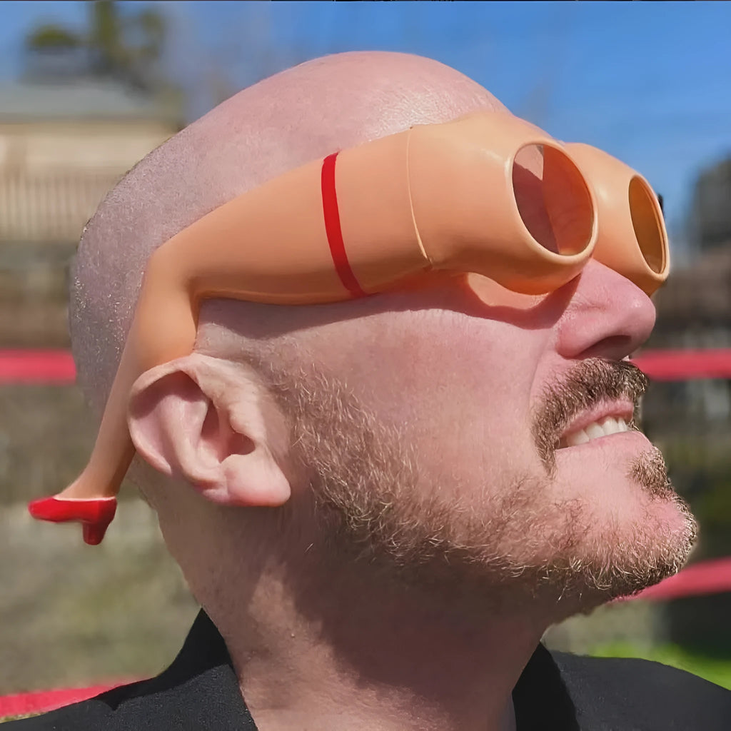 Orange plastic novelty sunglasses with leg hip design and oversize frame dimensions