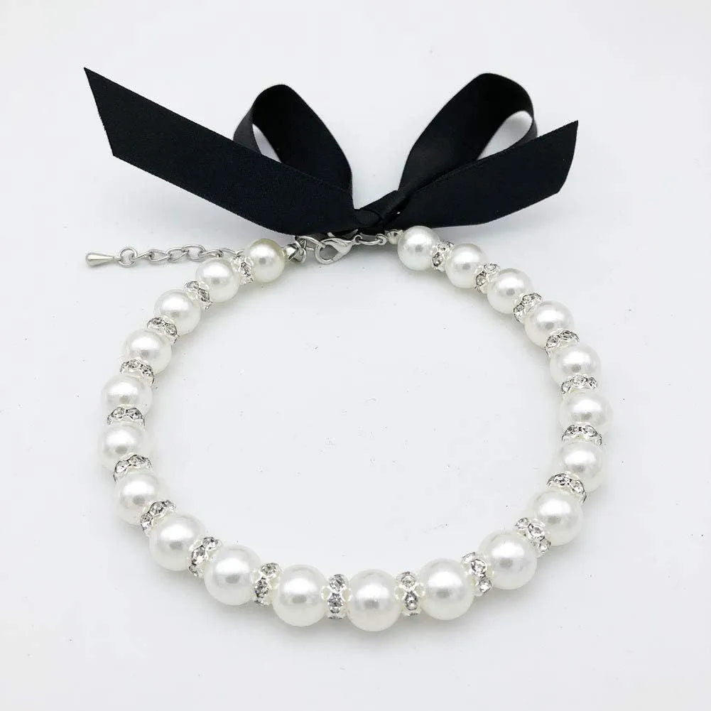 Adjustable pearl and rhinestone dog necklace on a soft ribbon in blue colour