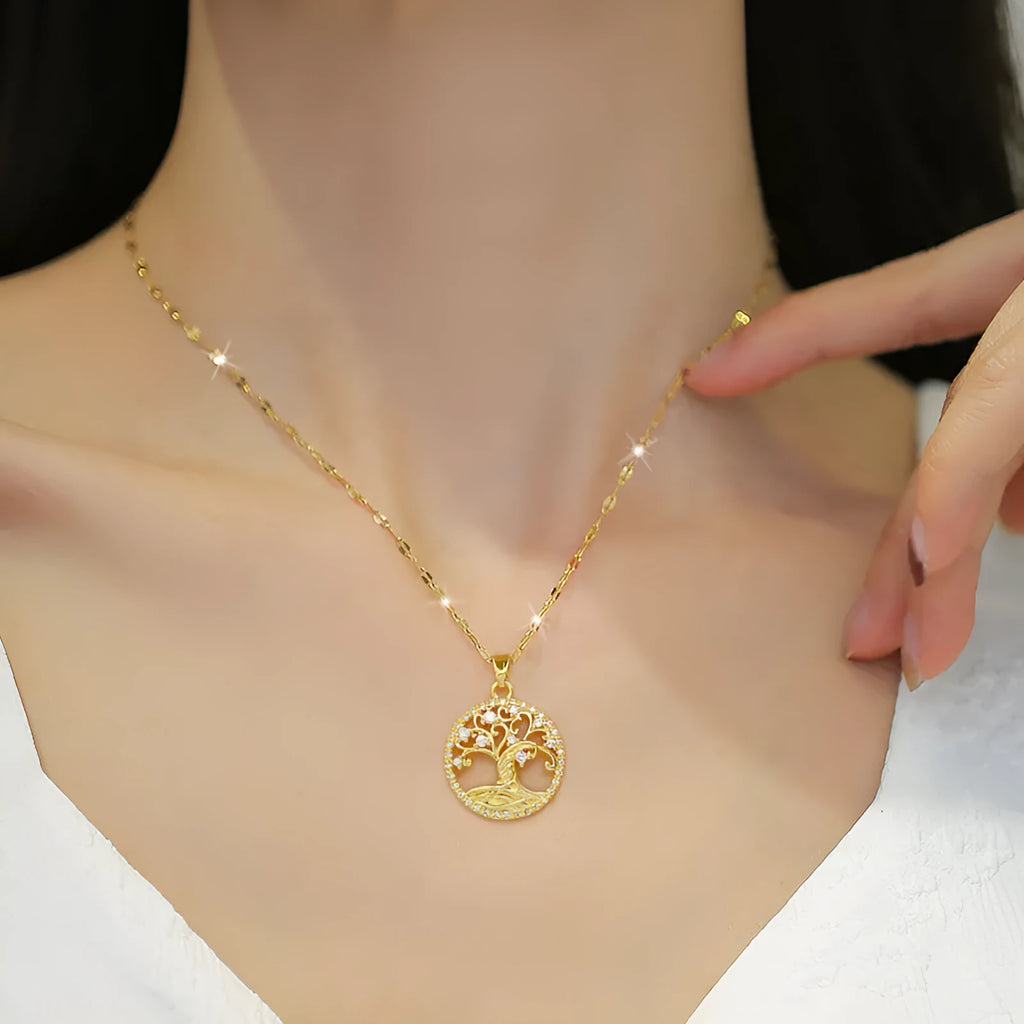 Gold-plated cross necklace with mother pearl inlay and rhinestone detailing on adjustable chain
