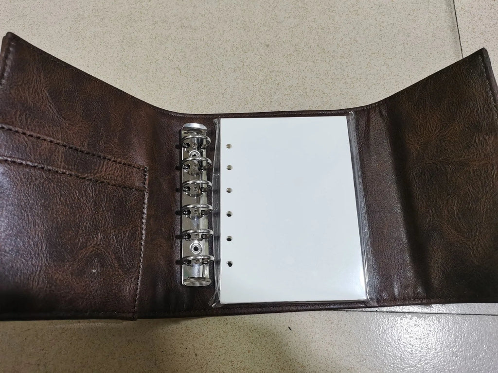 Brown retro leather-style A7 notebook with buckle closure and loose-leaf binding