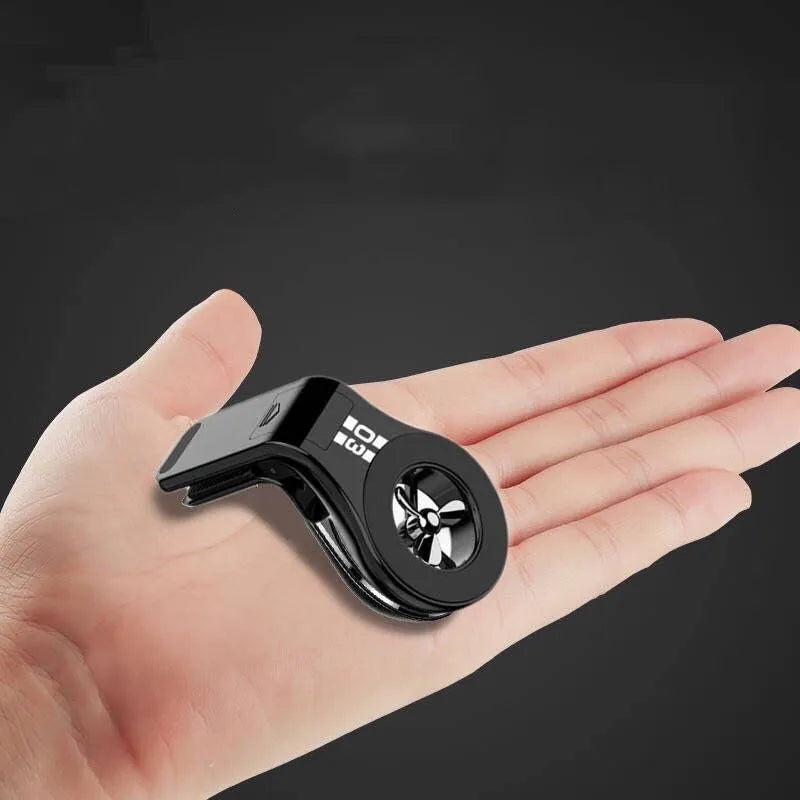Magnetic car phone holder mounted on air vent with smartphone attached