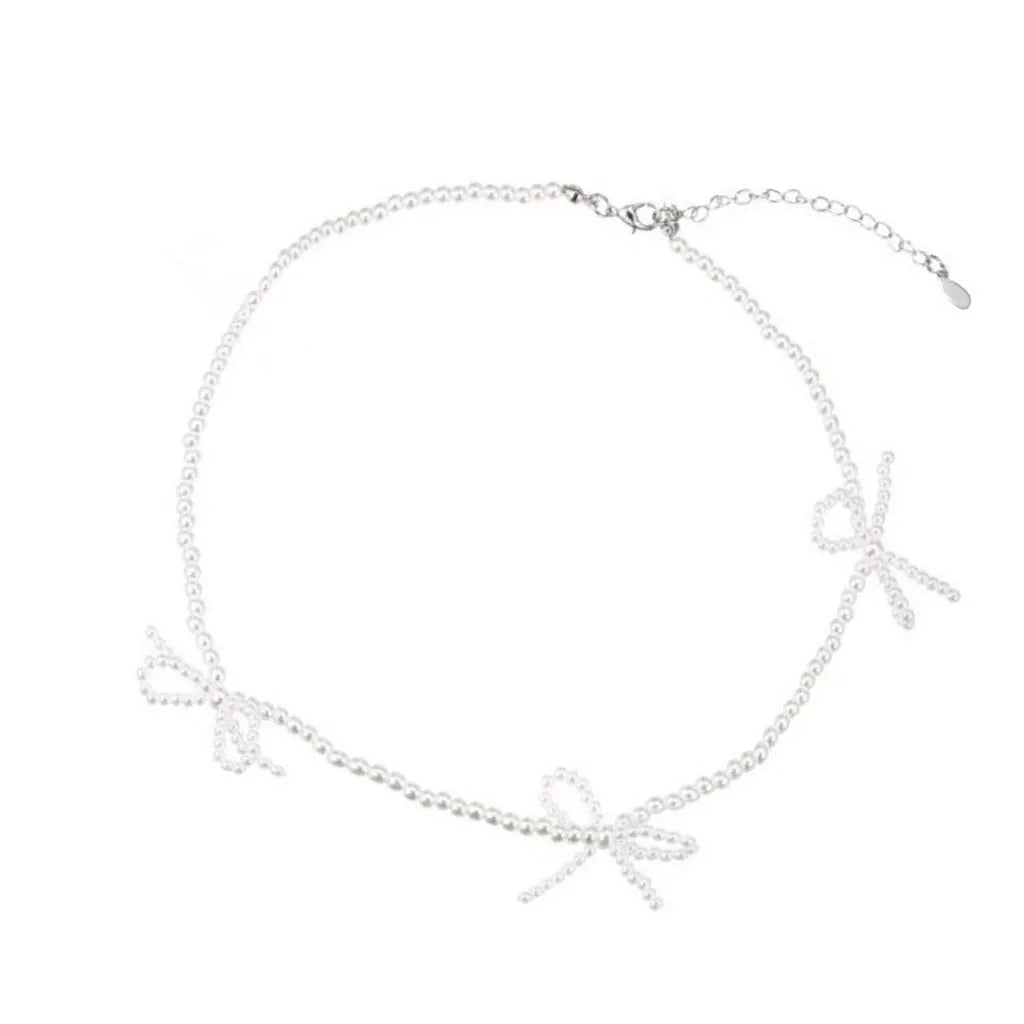 White imitation pearl necklace with geometric bow pendant on adjustable 31-40cm chain