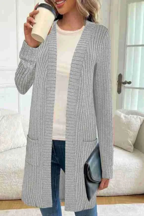 Loose long sleeve knitted cardigan jacket in black with side pockets.