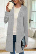 Loose long sleeve knitted cardigan jacket in black with side pockets.