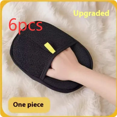 Black pet hair remover glove with silicone bristles for deshedding dogs and cats.
