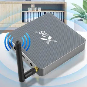 Android Smart Voice Set-top Box with remote control, HDMI cable, and power adapter on a table.