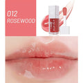 Mint lip gloss tube in one of five colours including bright pink, orange and dark red.
