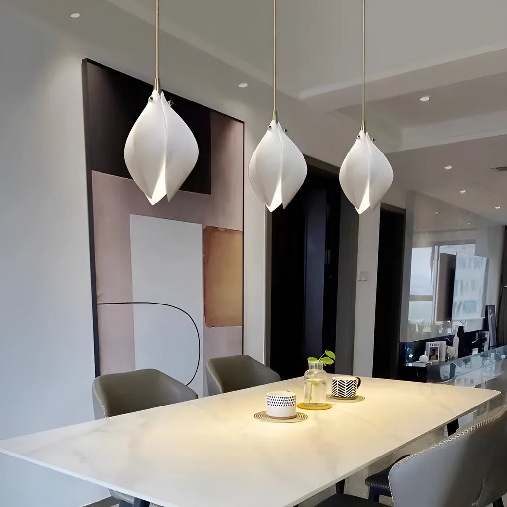 Ceramic magnolia flower-shaped single head pendant chandelier light with a dimmable bulb.
