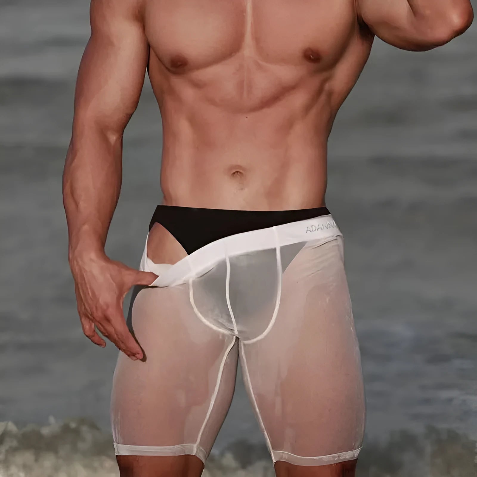 Men's black seamless mesh home shorts made from knitted nylon fabric
